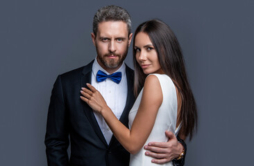 studio shot of formal tux couple in love. elegant love couple wear formal tux.