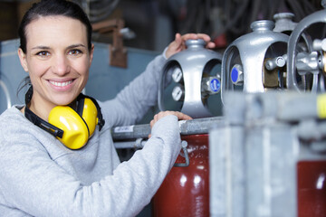 happy woman in an oil and gas factory