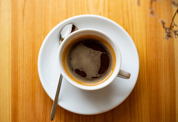 Cup of coffee on wooden table.