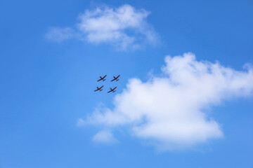 Modern airplanes flying in blue sky