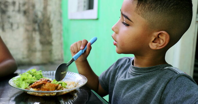 Brazilian Kids Eating Lunch At Home. Siblings Eat Food Together