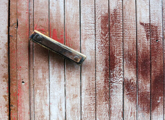 An old handle on a wooden door