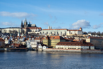 Fototapeta na wymiar Prague cityscape panoramic beautiful view, river Vltava and buildings in Prague. Cathedral st. Vito city in the old town. Capital of Czech Republic.