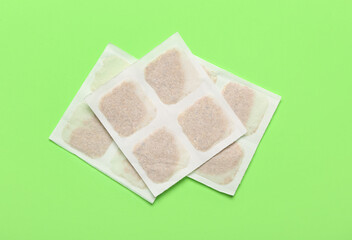Mustard plasters on green background