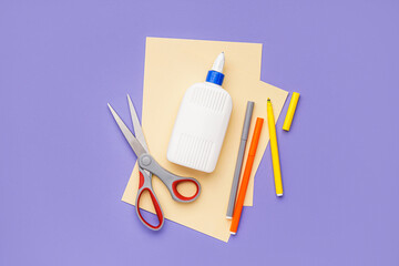 Set of stationery with glue on color background
