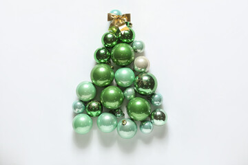 Christmas tree made of different balls on white background