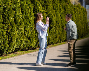 Obraz premium Happy young couple taking promenade in spring park