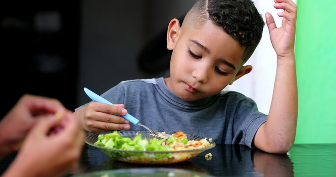 Brazilian Boy Eating Lunch. Mixed Race Hispanic Kid Eats Lunch