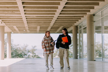 Two confused high school girls walking