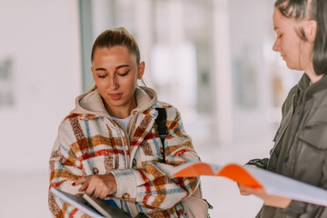 High school girls holding notebooks