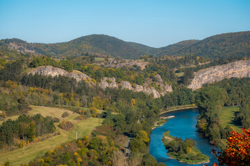 a body of water with a mountain in the background