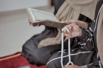 Muslim Women Reciting Quran at Home