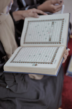 Muslim Women Reciting Quran at Home