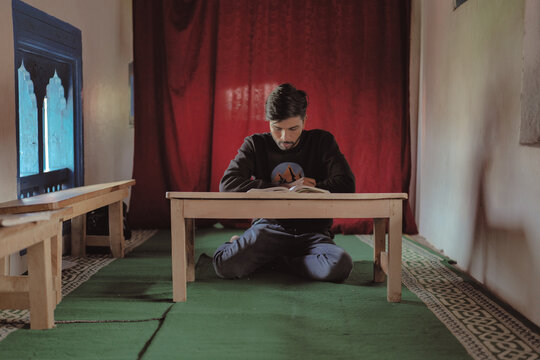 Young Muslim Men Reciting Quran