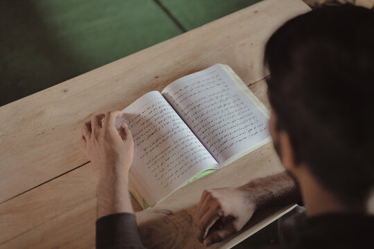 Young Muslim Men Reciting Quran