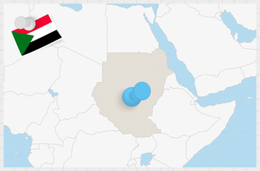 Map of Sudan with a pinned blue pin. Pinned flag of Sudan.