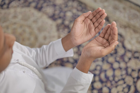 Portrait of Indian Muslim Boy Praying at Home