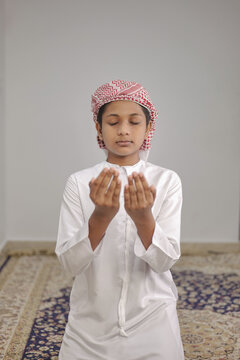 Portrait of Indian Muslim Boy Praying at Home