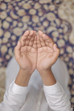 Portrait of Indian Muslim Boy Praying at Home