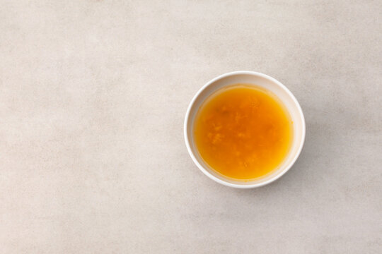 Yuzu tea or Yuja cha on stone table, top view. Popular Korean tea. Honey citron beverage. Healthy drink