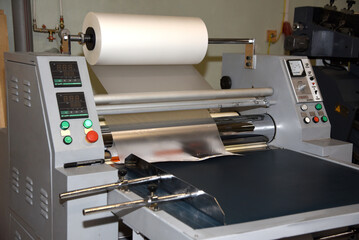 Electric industrial laminator for applying film to paper in the production shop