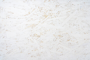 Fototapeta premium Oriented strand board OSB painted white. Background of rough surface made of compressed sawdust. Construction backdrop