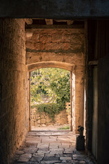 Old, stone passage in Roman Tower located in Skrip, the oldest village on Brac island, Croatia