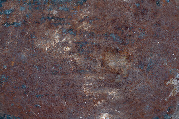 Grunge rusty metal background or texture with scratches and cracks, closeup, top view