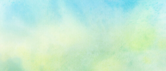 Green watercolor background for design. Abstract yellow and green spots blurred by water.