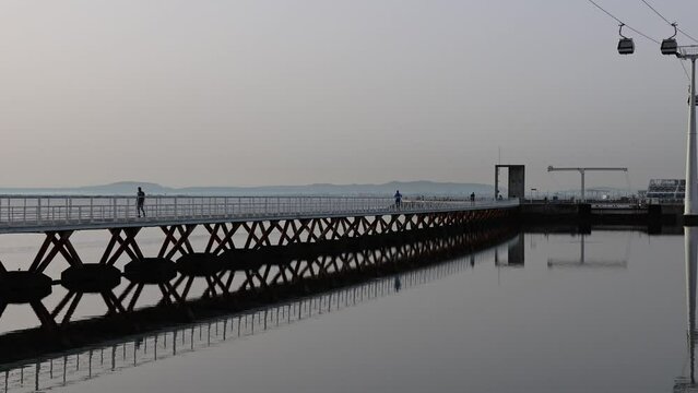 Sunrise by the Tagus River at Parque das Nacoes in Lisbon, Portugal