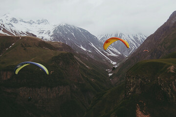 paragliders in the mountains