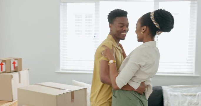Property, black couple and success moving in by black woman and man hug in celebration of being homeowners. Real estate, black family and happy, excited woman and guy celebrating new home living room
