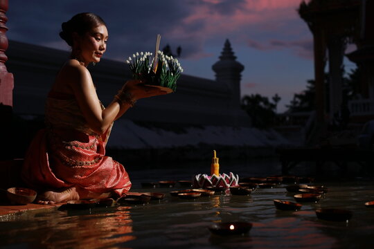 Portrait Beautiful Young Asia Woman With Traditional Thai Costume Hold Banana Leaf Cockerel Or Kra Thong In Thai , Loy Krathong Festival On November