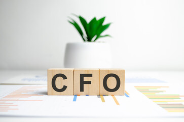 Fototapeta na wymiar concept word CFO on cubes on a charts