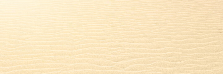 Fototapeta na wymiar Close up on Beach Sand texture background for wallpaper and poster. Sandy beach. Side Top view. Long banner.