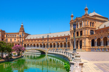 Fototapeta na wymiar Canal, bridge, mosaic, ceramic art in Plaza de Espana, Seville, Andalusia, Spain