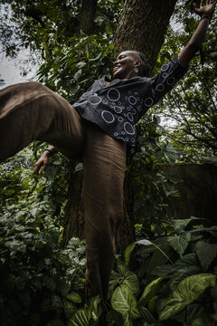 a black woman having fun in a garden