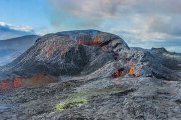 Volcanic crater in the day with sunshine. active volcano after eruption. Last lava remains on the...