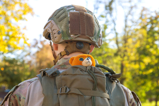 Soft Toy In A Backpack On The Back Of A Soldier Of Ukraine