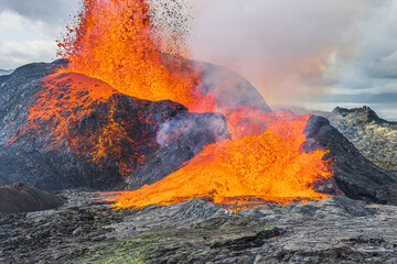 Lava fountain from the volcanic crater. active volcano in Iceland erupting. Volcanic landscape on...
