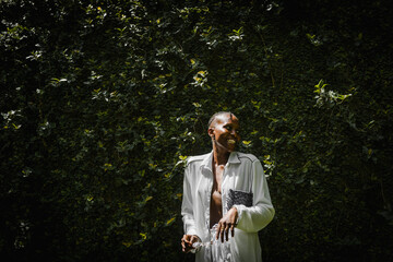 a black woman laughing in a garden
