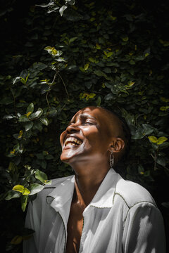 Closeup of black woman smiling in garden 