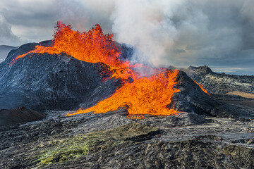 liquid lava from a volcano in Iceland. Volcanic landscape on the Reykjanes Peninsula. Glowing red...