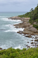 Coastline, waves on the rocks.
