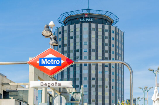 MADRID, SPAIN – OCTOBER 6, 2021: Madrid metro sign at Begona subway station, with La Paz Hospital building in the background