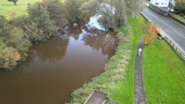Aerial shot of the river Stanley with the highway on the side in Carlow, Ireland