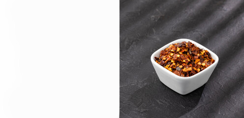 Crushed red pepper in a ceramic bowl