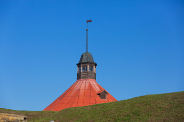 Korela fortress in Priozersk, Russia. Stone tower on the background of blue sky. Autumn landscape with castle on a sunny day