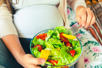 Obraz na płótnie Canvas Pregnant healthy food diet. Pregnancy woman eating nutrition diet food salad. Healthy vegetarian food, healthy lifestyle.