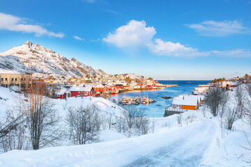 Outstanding morning seascape of Norwegian sea and cityscape of Sorvagen town.